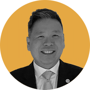 An image of Foundation board member Mr Craig Ng. Image in black and white with a yellow background.