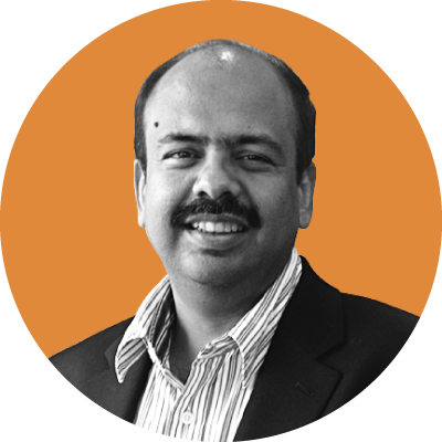 An image of Foundation board member Mr Sharad Sanghi. Image in black and white with an orange background.