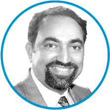 An image of committee member Suchit Nanda in black and white, inside a blue circle.