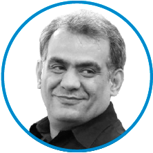 An image of committee member Tariq Zaman in black and white, inside a blue circle.