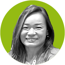 An image of Foundation Administrative Assistant Panida Kijrattana, in black and white, on an olive green background.